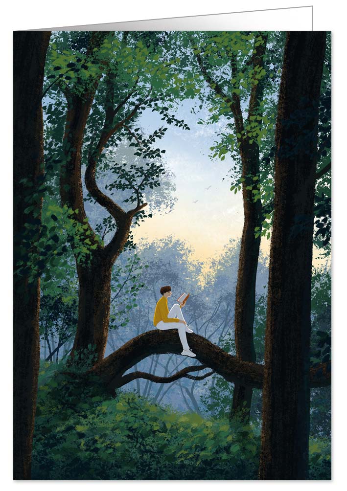 Man reading a book on a tree