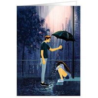 Man holding umbrella over woman