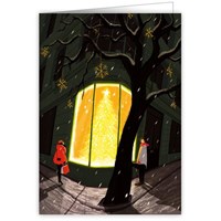 Couple looking at lit tree in shop window